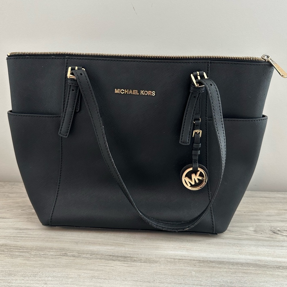 Black leather. Gently used Michael Kors bag